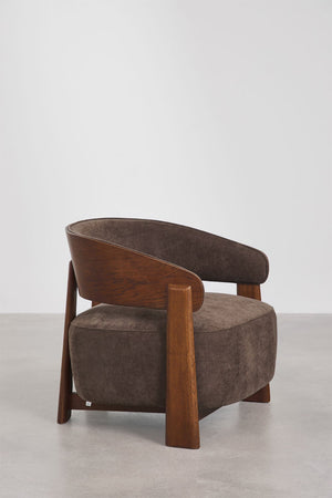 Olea armchair – lifestyle shot in warm interior setting