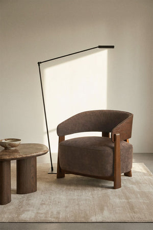 Olea armchair – rear three-quarter view showing exposed oak backrest