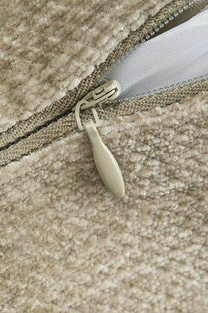 Lesoto bolster cushion – three-quarter end view of army green bolster, circular end cap with white piping visible