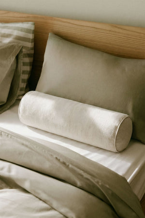 Lesoto bolster cushion – close-up of army green velvet texture, upper angle, muted sage tones with subtle sheen