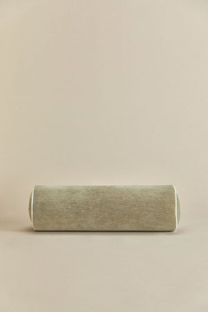 Lesoto bolster cushion – close-up of white piping edge detail on army green velvet, end cap junction