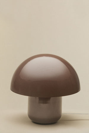 Zyora table lamp illuminated in a warm interior