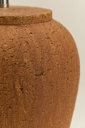 Verena terracotta lamp illuminated with a warm glow