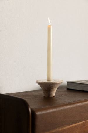 Bellvion travertine candle holder – full studio shot on warm beige background, no candle, showing inverted cone silhouette and pitted stone texture