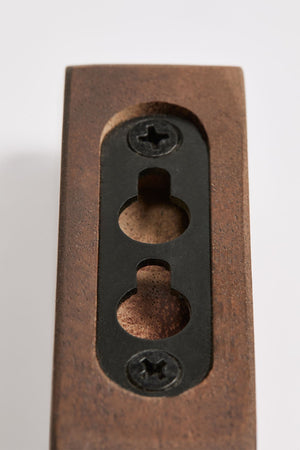 Brana wooden wall hooks – set of four dark walnut hooks mounted in a horizontal row on white wall, evenly spaced, no items hung