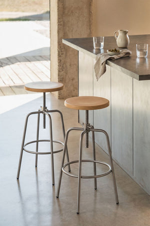 Bangalore high stool – front view on white background, full height, natural beechwood seat and brushed stainless steel frame