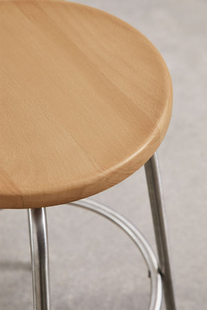 Bangalore high stool – close-up of stainless steel circular footrest ring and leg junction