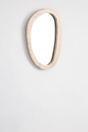 Urkiz irregular mirror – three-quarter view leaning against white wall, portrait orientation