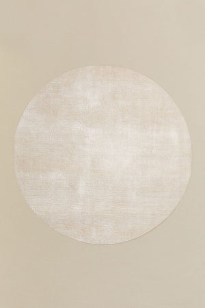 Daroca round rug – overhead flat lay on beige background, full circular shape visible