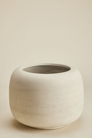 Annabeth concrete planter – close-up of small size shoulder and rim, showing the wide curved shoulder tapering to the opening and the tactile porous concrete surface