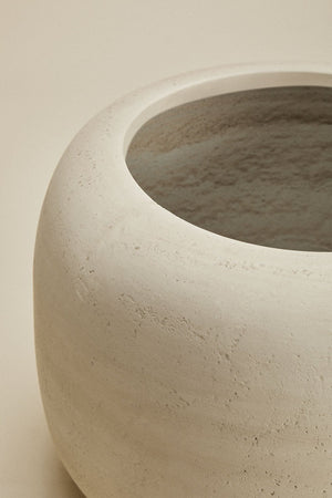 Annabeth concrete planter – close-up of large size rim and opening, showing the bevelled inner lip and slightly rough concrete texture with warm off-white tone