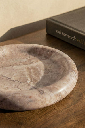 Close-up of the Velmar marble tray rim and veining
